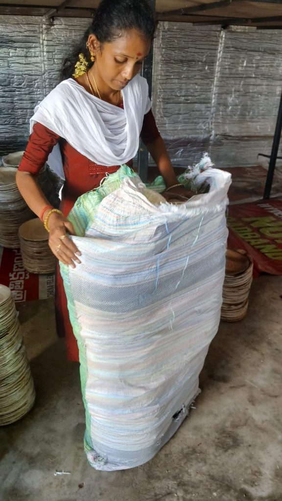 Worker packing Areca pakku mattai plate in the polysack bag